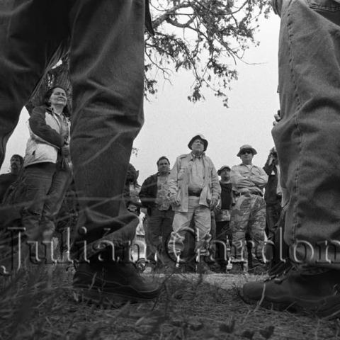 A group of men standing in a circle