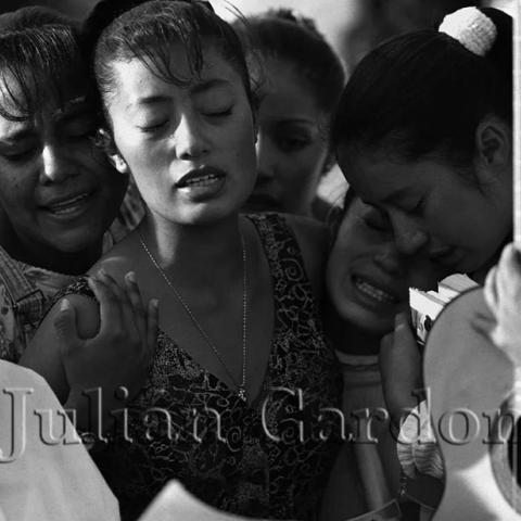 Women singing and showing emotion.