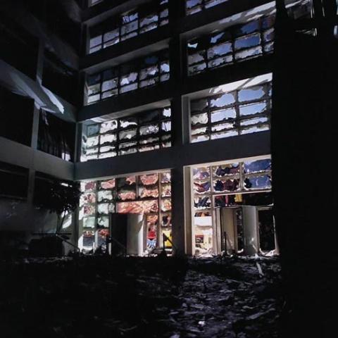 Broken windows in a building