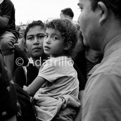 Mother and daughter in a crowd.