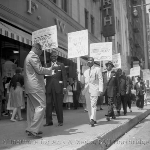 People protesting with sign boards 