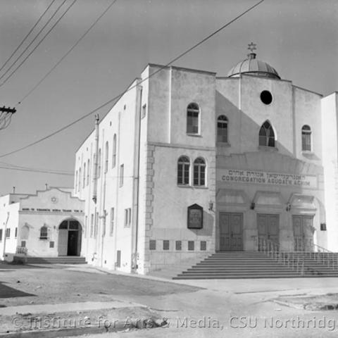 A white 3-story building 