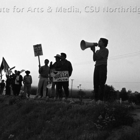 People protesting with signs.
