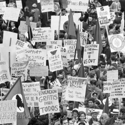 A large group of protestors holding signs