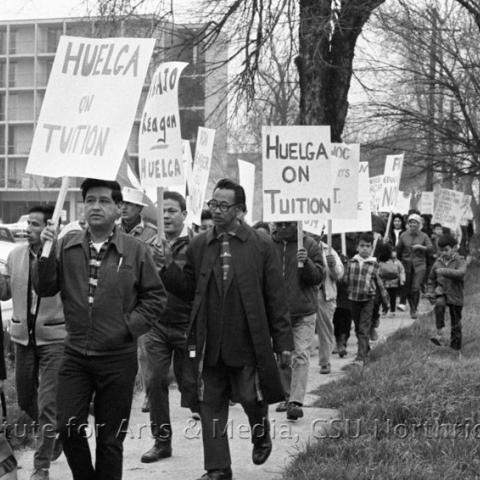 A protest group walking in a rally.