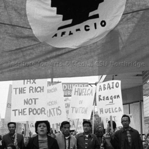 A protest group walking in a rally.