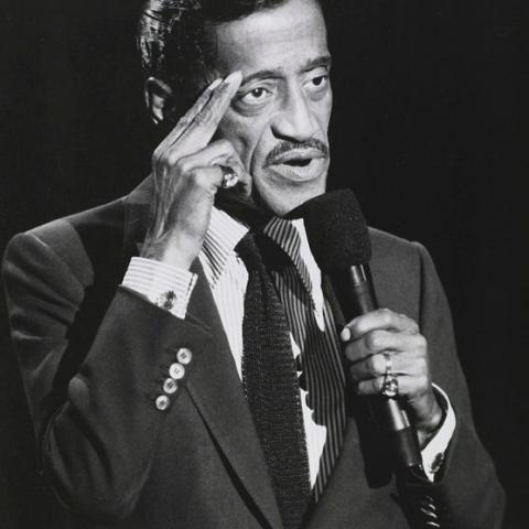 A man speaking into a mic.