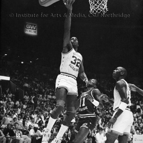 Men playing basketball.