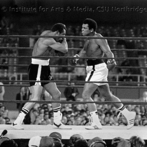 two men boxing in a ring