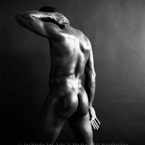 Naked man posing.