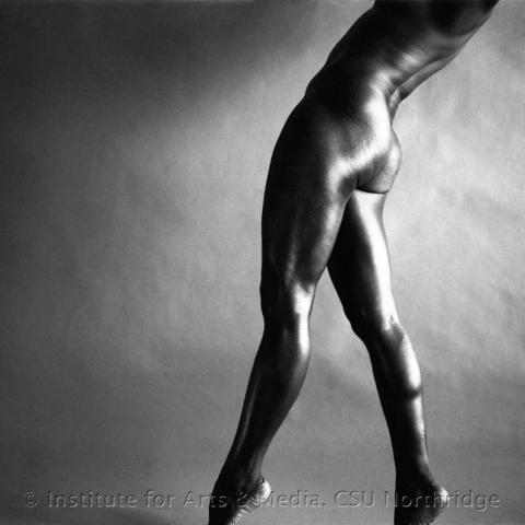 Naked man posing.