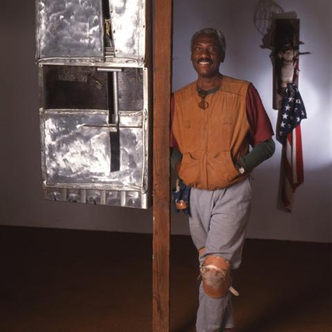 A black man posing.