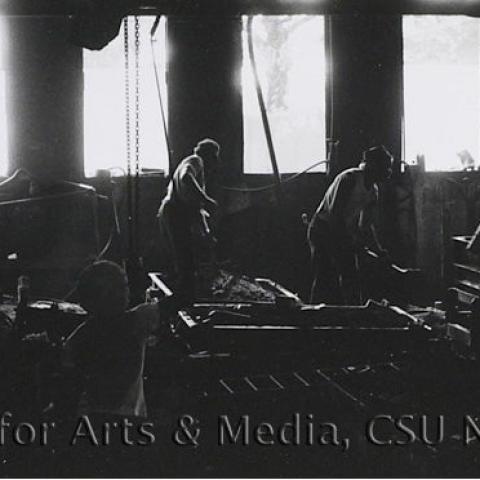 People working in a factory.