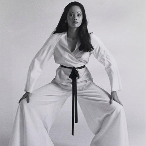 A model posing in martial arts outfit.