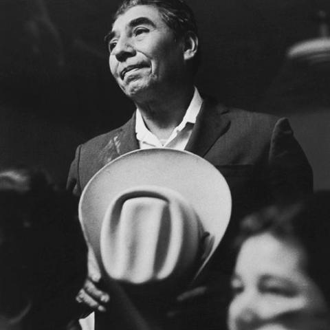 A man holding a hat in his hand.