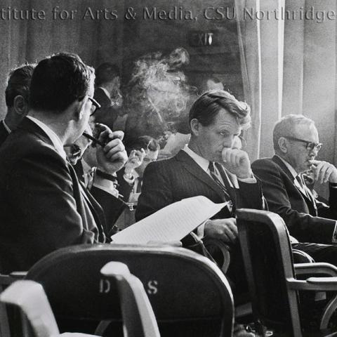 Men sitting at a panel 