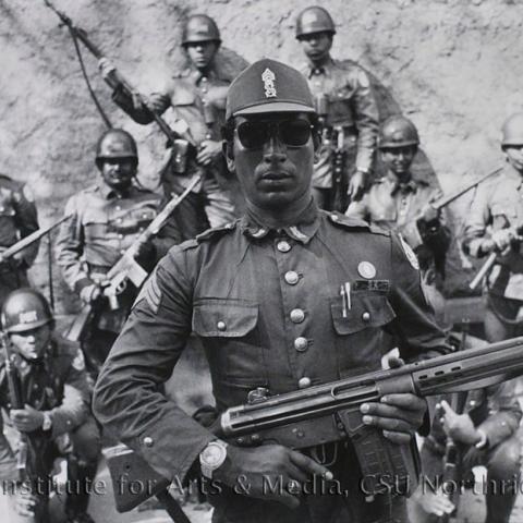 Soldier posing with their guns.