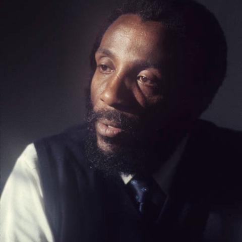A black man with a beard.