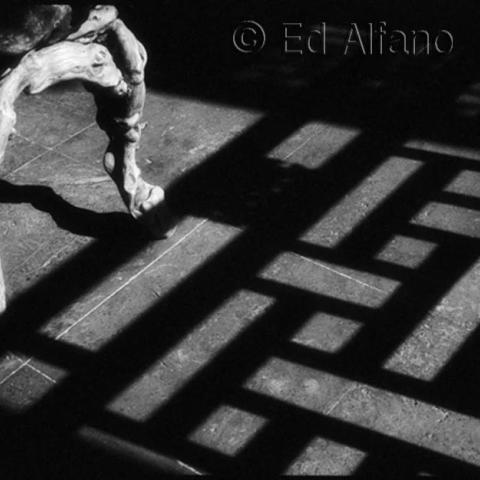 Angular shadow pattern on pavement