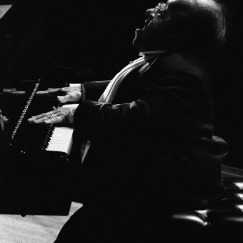  A man playing the piano.