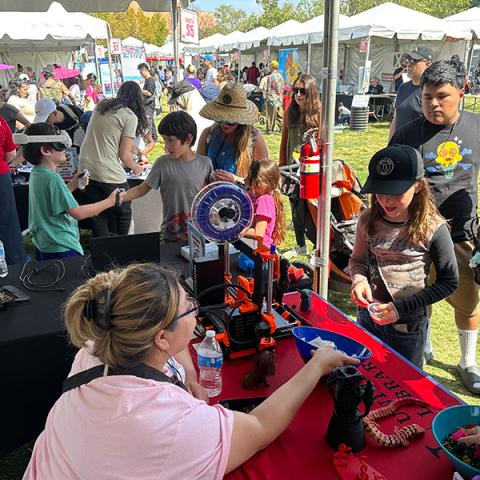 Kids visiting the CMS table