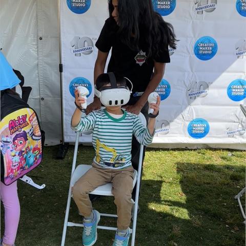 Child playing with virtual reality headset