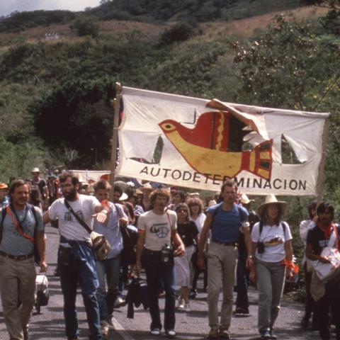 Marchers in the International March for holding a banner that reads “Autodeterminacion,” near the Nicaraguan and Honduras border. Box 3, Folder 1.