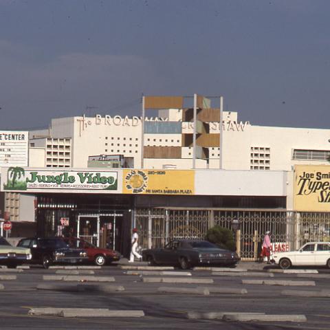 A strip mall of store fronts adjacent to the Crenshaw Plaza, circa 1980-1989. Roland Charles Collection, Box 78. 