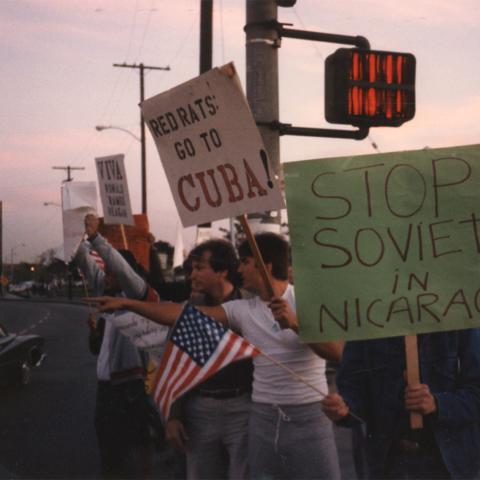 Anti-Sandinista protesters, holding American flags and signs that read “Stop Soviets in Nicaragua.” Box 1, Folder 8.
