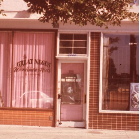 The Great Negus Wordsmith & Roots Empire, a short-lived arts venue in Leimert Park opened by Richard Fulton. “Negus” is the Amharic word for “king” and is a language revered among Rastafarians, a community that greatly contributes to the culture and spirit of independent entrepreneurship of Leimert. Fulton owned and operated several businesses in Leimert Park to give the community a space to express themselves creatively. 1998. Roland Charles Collection, Box 75.