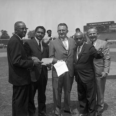 Assemblymen F. Douglas Ferrell and Mervyn Dymally, first two at left, and Councilman Gilbert Lindsay, second to right. Conference for the Unemployed, 1964 May 7, Harry Adams Collection, 09.01.HA.N45.B20.120