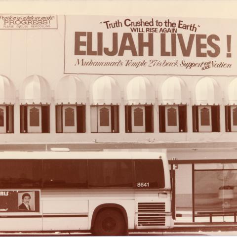 A bus passes the temporary location of the famous Muhammad’s Temple of Islam 27 mosque on Crenshaw, after its original Broadway location was destroyed by an earthquake. The mosque was established by the local chapter of the Nation of Islam, with help from one of its most famous ministers, Malcolm X. Circa 1980-1989. Roland Charles Collection, Box 82. 