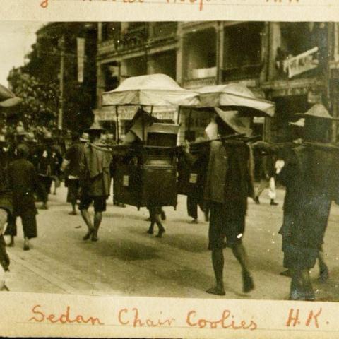 Hong Kong street scene with a sedan chair