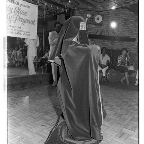 A beauty pageant contestant wears an abaya and a niqāb, ca. 1980s