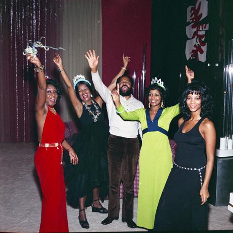 From left, an unidentified woman, Gwen Gordy, Barry Gordy, Iris Gordy, and an unidentified woman celebrating at a New Year's Eve party. Guy Crowder Collection