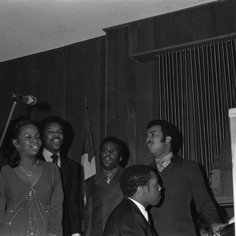 Gladys Knight and the Pips, Bubba Knight, Edward Patten, and William Guest, are accompanied by a piano player as they perform during the Southern Christian Leadership Conference (SCLC) Operation Breadbasket event at Victory Baptist Church. Guy Crowder Collection