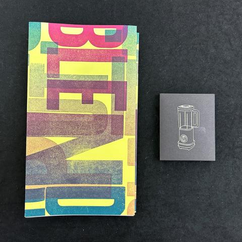 multi-colored book cover with title next to small rectangle pack of prints with a graphic of a blender in gold; Put It In a Blender by the Spring 2019 Printmaking III: Relief class with instructor Jamie Russom, N7433.4.P88 2019
