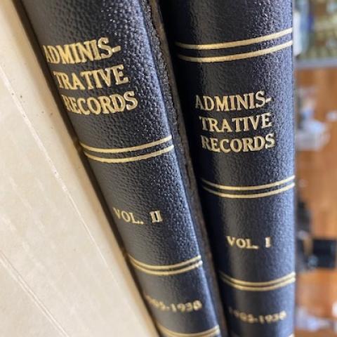 Spine of both volumes from the Los Angeles Weather Station Logbooks, "Administrative Records, 1905-1938" written in gold, SC.LAWS