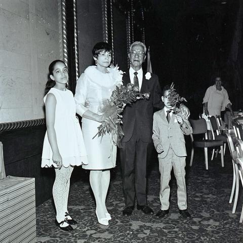 Mr. Llyod Dickie posing with guests at his retirement party, 1969, Jack Davis Photograph Collection, Box 17 Folder 6.