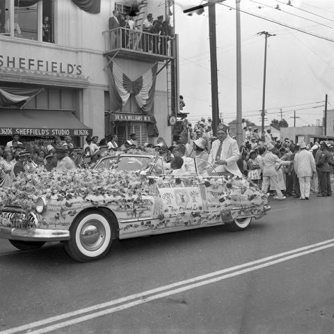 Improved Benevolent Protective Order of Elks of the World (I.B.P.O.E.) car in a parade. From the Harry Adams Collection.