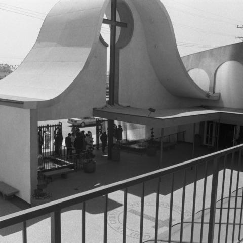 View from a balcony of the interior patio of West Community Development Center located on Crenshaw Boulevard in Los Angeles. The West Angeles Church was founded in 1943 and grew to offer outreach and neighborhood development services, 1987. Guy Crowder Collection, 11.06.GC.N35.B23.34.207.18.