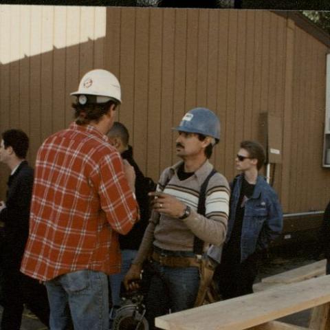 Students, faculty, and construction workers mingle on campus as classes resume
