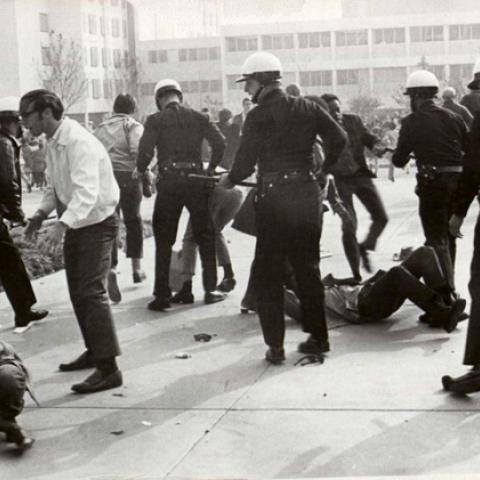 San Fernando Valley State College students are confronted by police officers, 1968. University Archives 