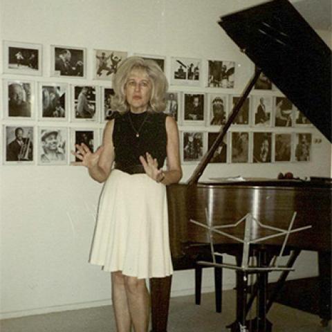 Photograph, Mimi Melnick welcoming guests to the Double M Jazz Salon, July 23, 2000