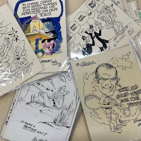Variety of cartoon illustrations from Chase Craig’s retirement scrapbook, 1975, Chase Craig Collection, Box 37.