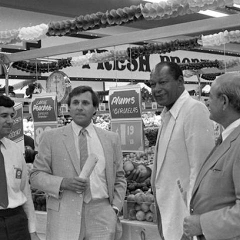 Boys Market manager Sam Baca, Boys Market President Pete Sodini, Los Angeles Mayor Tom Bradley, and Pacoima Plaza developer Herbert Piken visiting Boys Market in Pacoima Plaza following the ribbon cutting ceremony,1985, ID: RBF00 075
