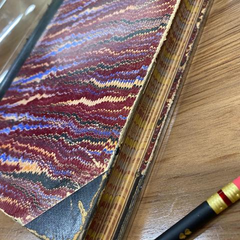 View of marbled book cover and marbled edges of pages, Brawley California Weather Station Logbook, SC.BWSL  