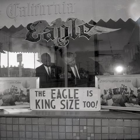 View through the window of the California Eagle Office. From the Harry Adams Collection.