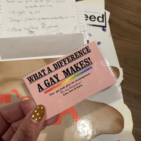 Gay pride encouragement card included in the bag. N6497 .M87 2004