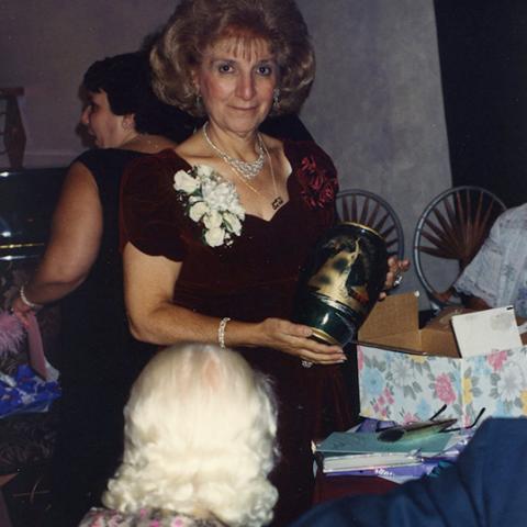 Sara Chitjian holding a retirement gift, 1994, Zruhy ”Sara” Chitjian Collection, Box 108 Folder 7.